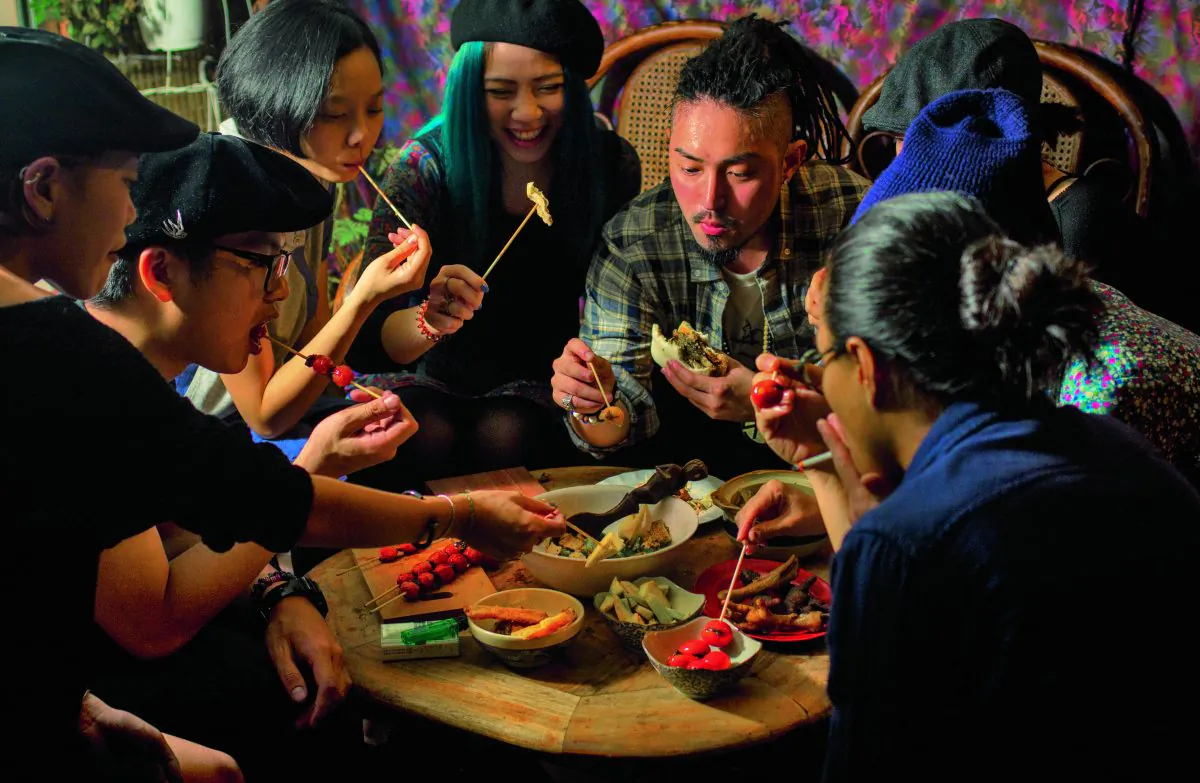 Young diners in Taiwan. (Recipes and photography from THE FOOD OF TAIWAN by Cathy Erway. Copyright © 2015 by Cathy Erway. Photographs by Pete Lee, 2015. Used by permission of Houghton Mifflin Harcourt Publishing Company. All rights reserved.)