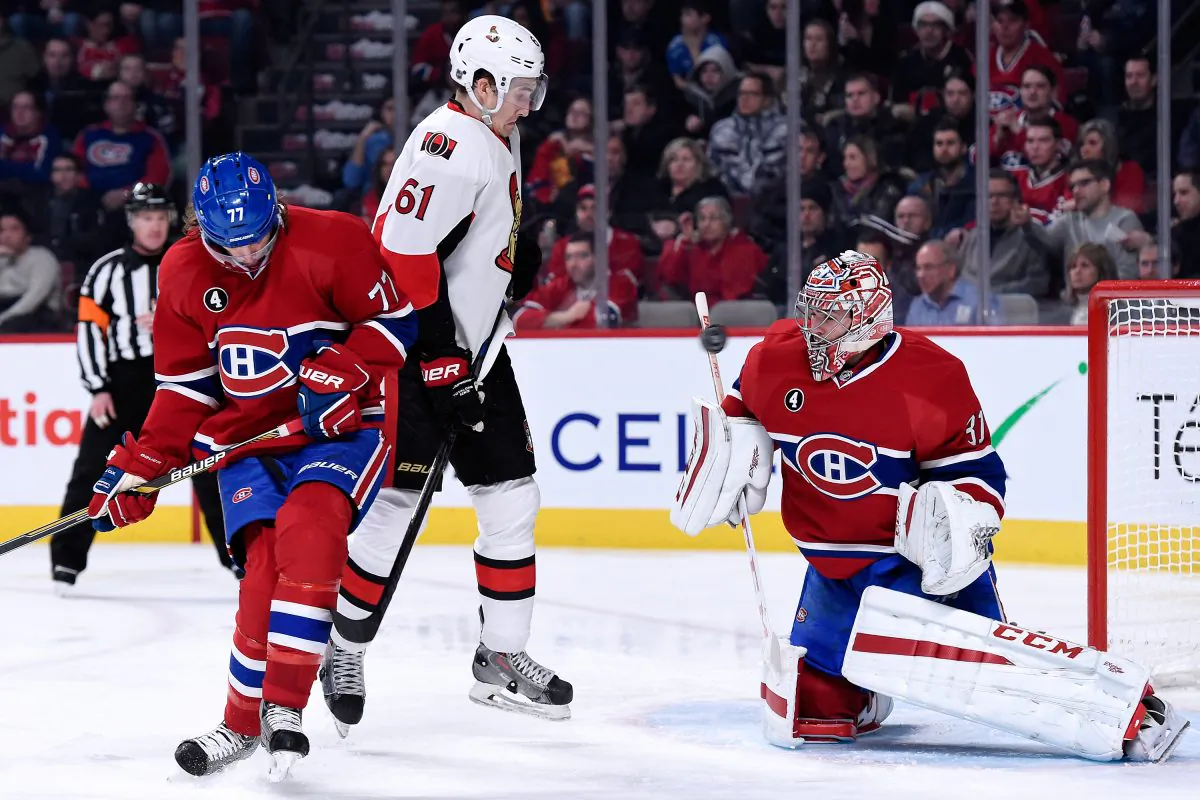 Carey Price stops the puck in front of Tom Gilbert and Mark Stone at the Bell Centre on Dec. 20, 2014 in Montreal, Canada. Montreal and Ottawa renew their rivalry in the NHL Playoffs starting Wednesday, April 15. (Richard Wolowicz/Getty Images)