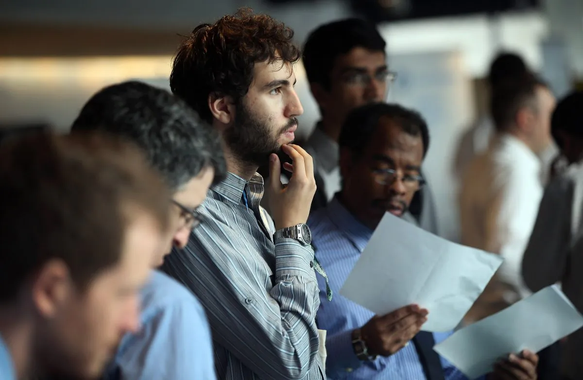 Job applicants wait to meet potential employers at the NYC Startup Job Fair held at 7 World Trade Center on September 28, 2012 in New York City. (John Moore/Getty Images)