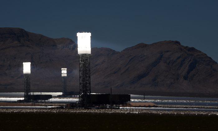 The three towers at the Ivanpah Solar Electric Generating System are shown in operation on July 23, 2014 in the Mojave Desert in California near Primm, Nevada. (Ethan Miller/Getty Images)