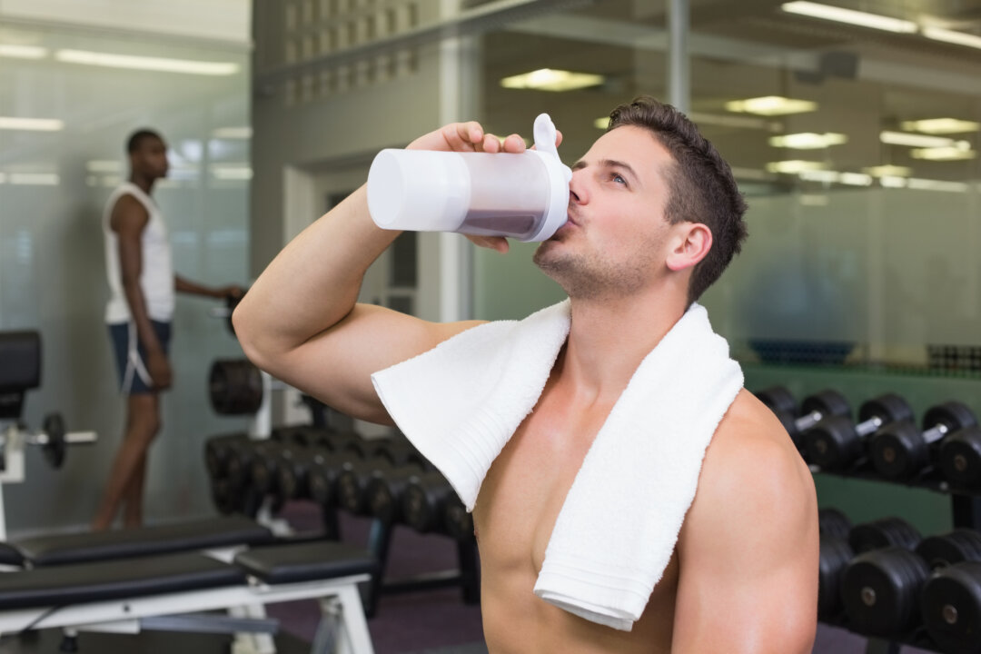 A body builder drinks a protein shake. (Shutterstock)
