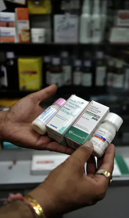 A pharmacist displays antibiotics, on Oct. 20, 2010 in Mumbai, India. The overuse of antibiotics has resulted in the proliferation of antibiotic-resistant diseases. (SAJJAD HUSSAIN/AFP/Getty Images)