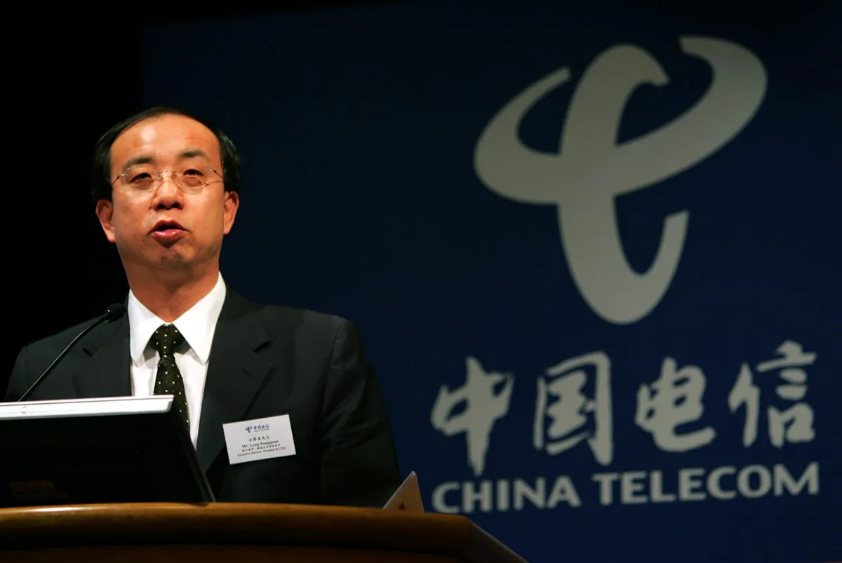 Leng Rongquan, executive director and President of China Telecom Corp., the country's biggest fix-lined telephone operator, speaks during a press conference in Hong Kong Thursday, March 31, 2005. ( AP Photo/Vincent Yu)