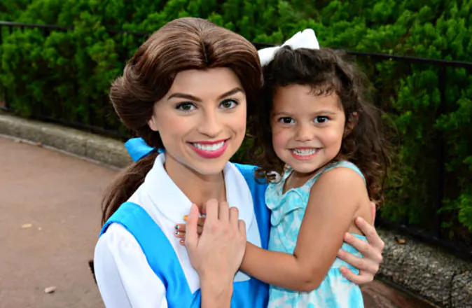Amélie has a huge smile when she meets Belle. At Walt Disney World, little girls get the chance to meet many of their favorite characters in person. (Janna Graber, Go World Travel Magazine)