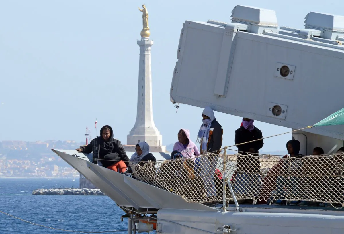 Migrants arrive in the port of Messina after a rescue operation at see on April 18, 2015 in Sicily. (Giovanni Solino/AFP/Getty Images)