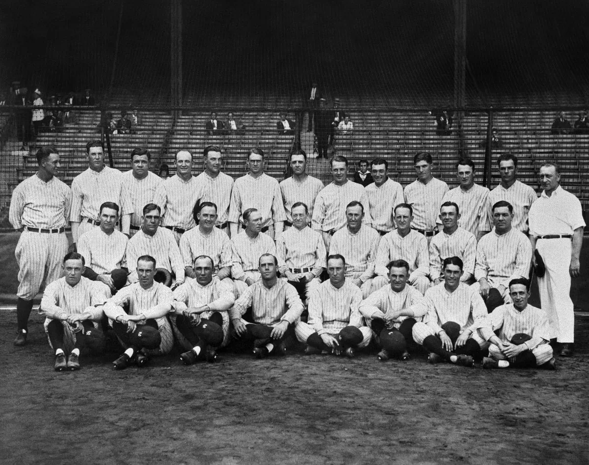 The 1927 New York Yankees, often mentioned in the same breath with "one of the best teams of all time." Lou Gehrig and Babe Ruth are, respectively, first and third from left in the back row. Manager Miller Huggins is at center, middle row. The batting order, better known as Murderers' Row, led nearly every offensive category in the league. The team finished at 110-44 (.714), 19 games ahead of the second-place Philadelphia Athletics. (AP Photo)