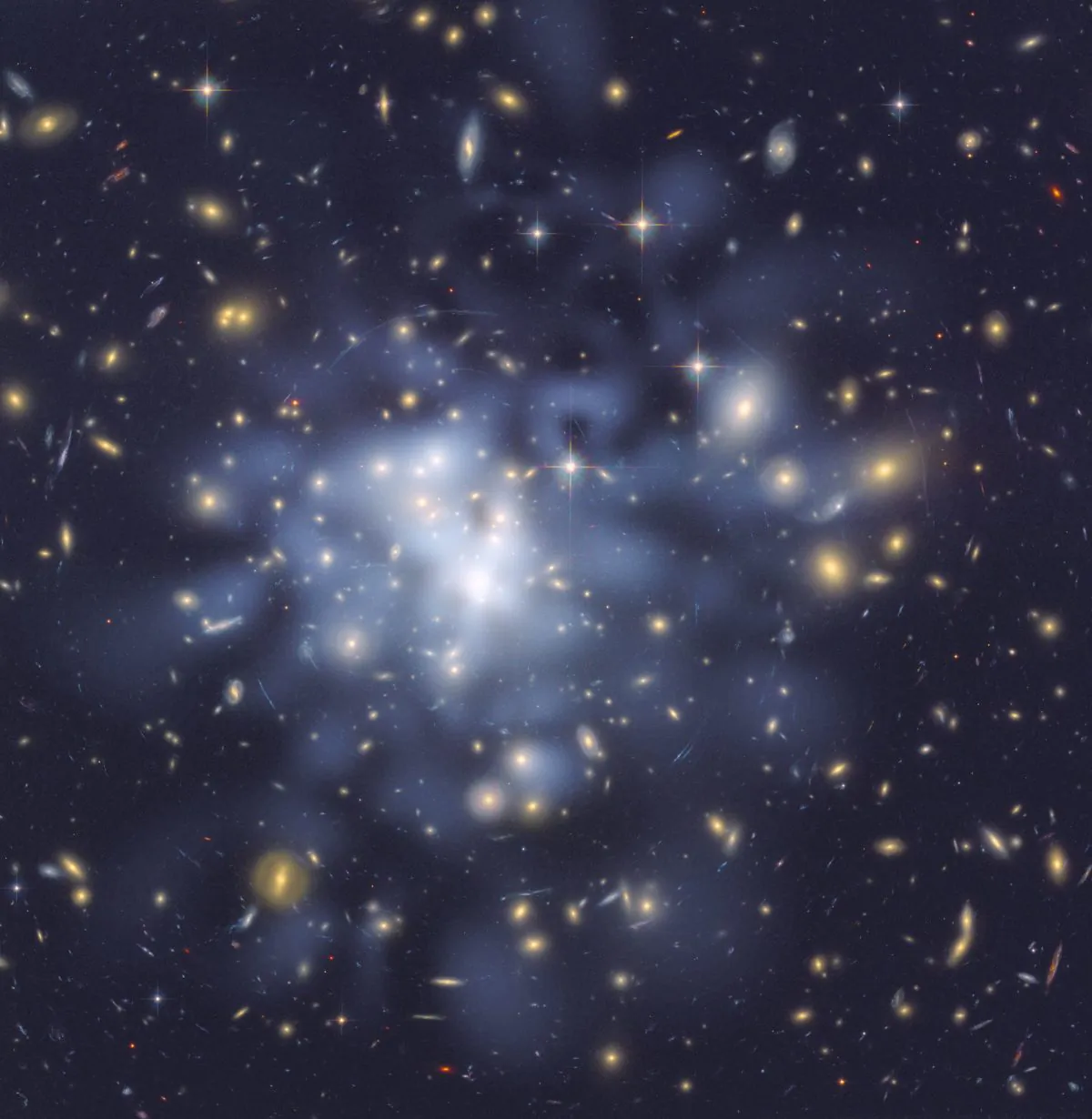 Dark matter is invisible and can be detected only though the effect its gravity has on things we can see such as passing rays of light – an effect known as gravitational lensing. (NASA, CC BY 2.0)