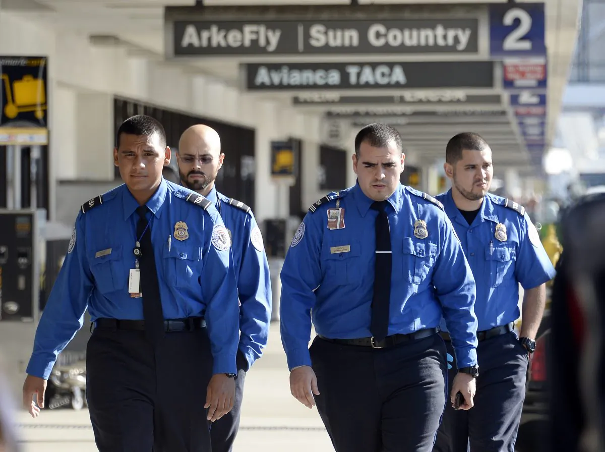 Transportation Security Administration agents walk on the departures level at Los Angeles International Airport November 2, 2013 in Los Angeles, California. (Kevork Djansezian/Getty Images)