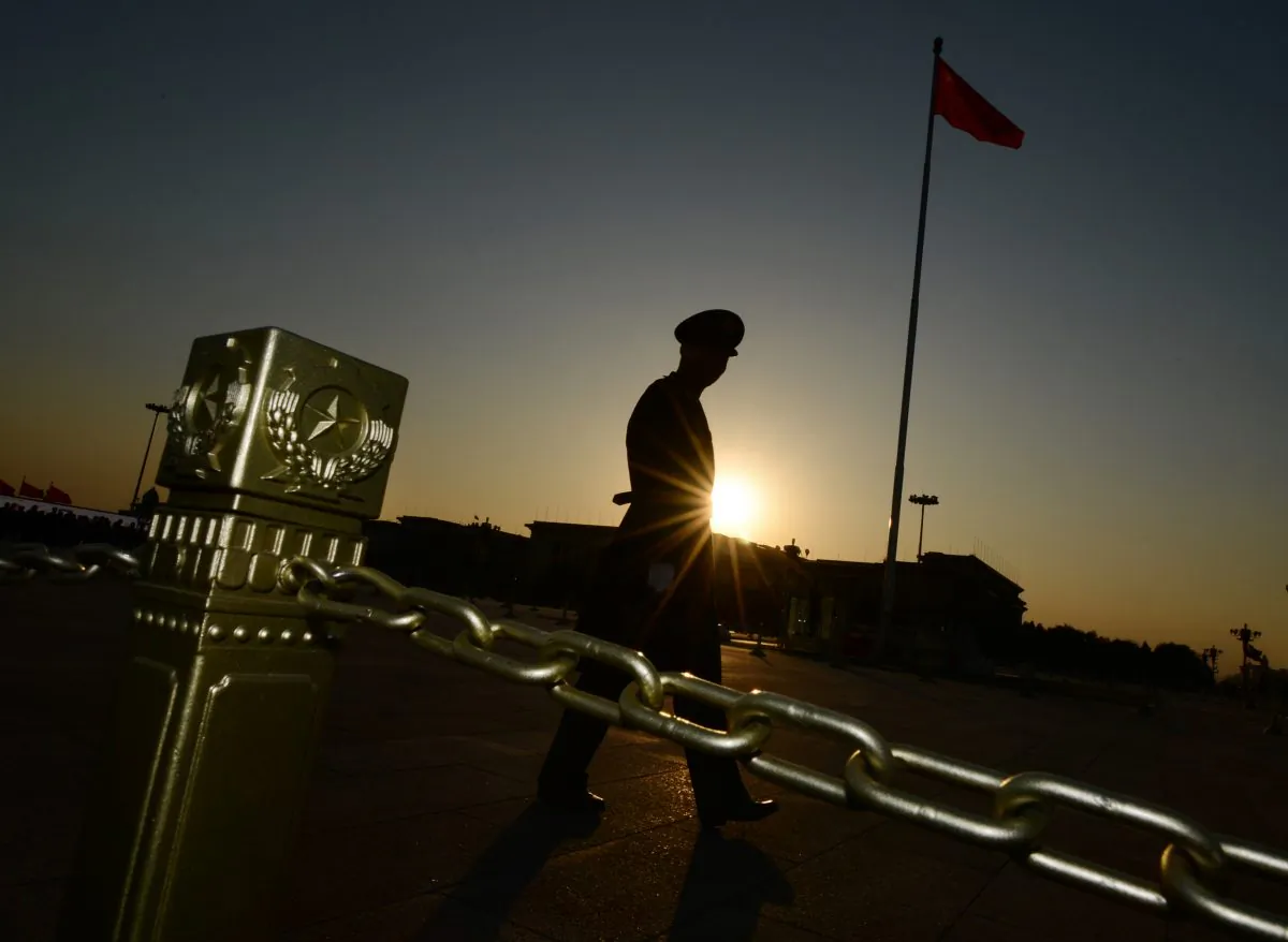 A Chinese para-military officer patrols Tiananmen Square in Beijing on November 12, 2013. Chinese cyberspies recently tried breaching the computer of NSA historian Michael Aid. (MARK RALSTON/AFP/Getty Images)