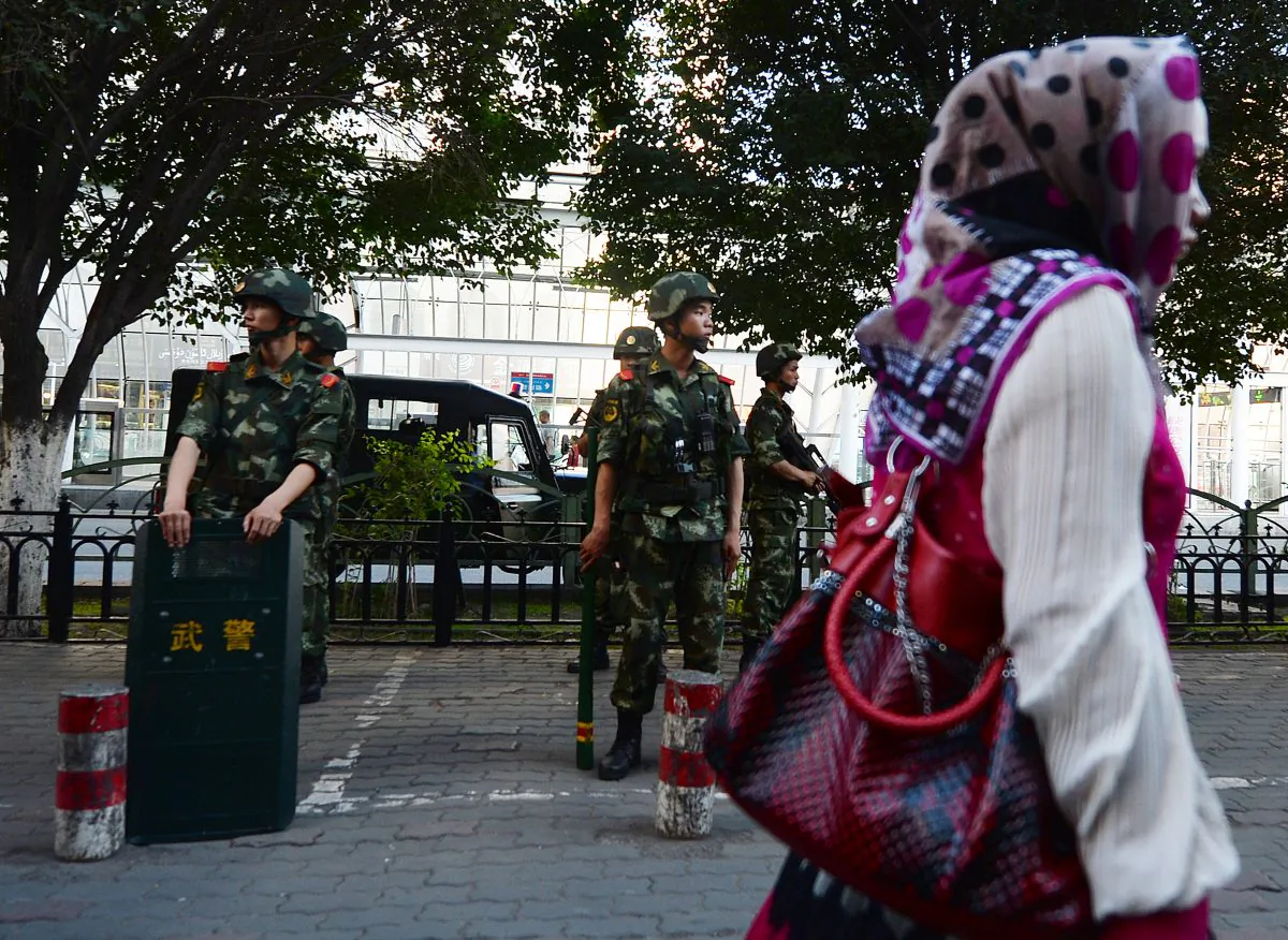 Chinese paramilitary police stand guard in the Muslim Uighur minority area of Urumqi, Xinjiang Province on June 30, 2013. (Mark Ralston/AFP/Getty Images)