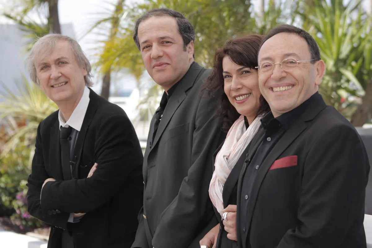 (L-R), cartoonists Plantu, Dilem, Willis From Tunis and Kichka support Cartooning For Peace at the 66th international film festival, in Cannes, France, on May 20, 2013. (AP Photo/Francois Mori)