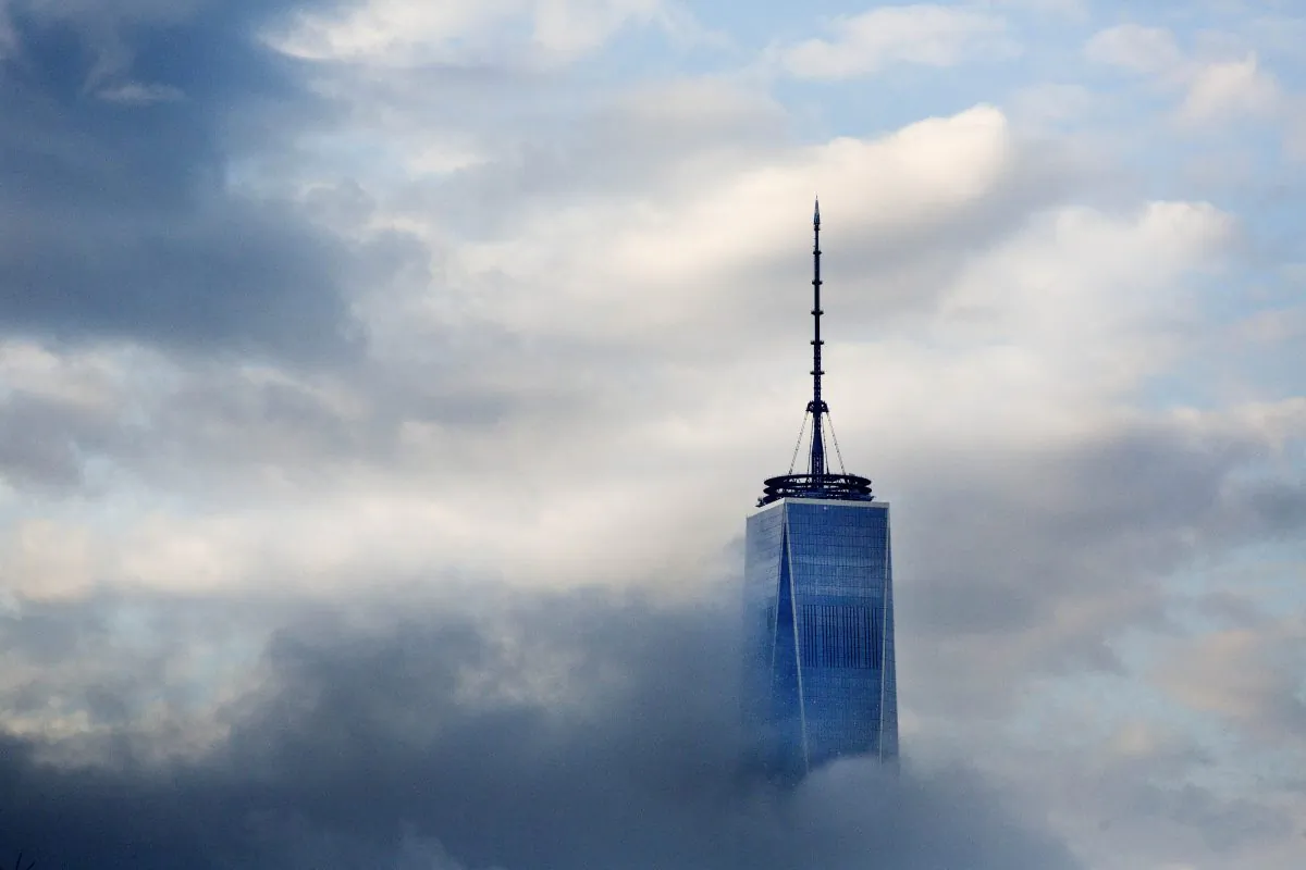 The One World Trade Center is surrounded by clouds in Lower Manhattan on April 21, 2015. (AP Photo/Mark Lennihan)