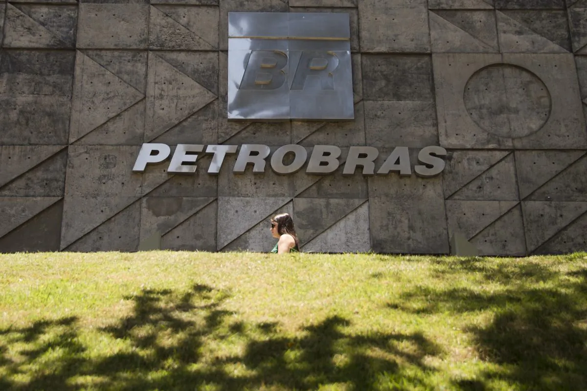 People walk past Petrobras building in Rio de Janeiro, Brazil on December 12, 2014. (Vanderlei Almeida/AFP/Getty Images)