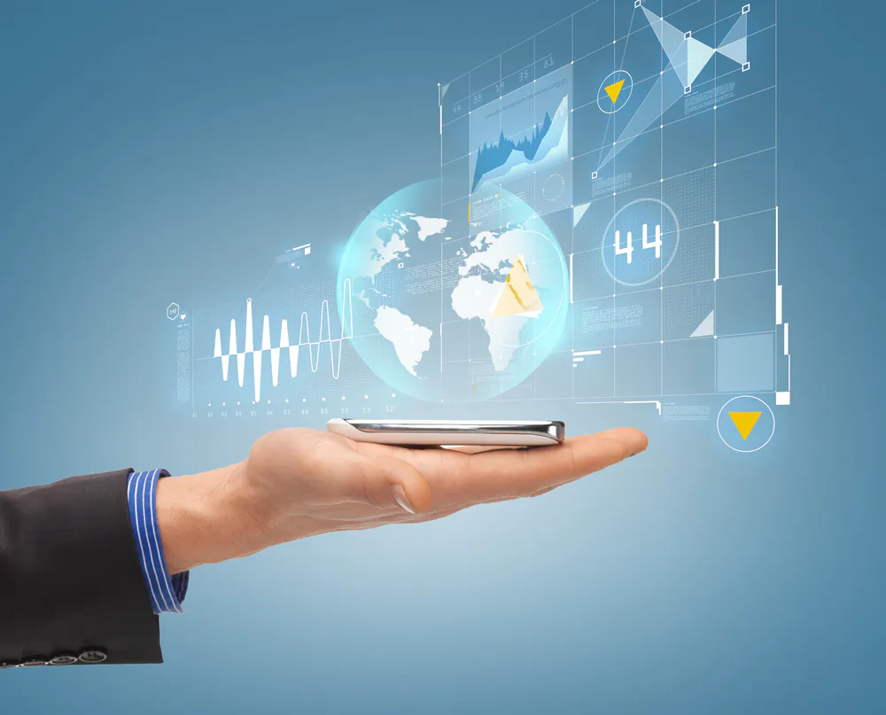 Close up of male hand with smartphone and hologram. (Syda Productions/Shutterstock*)