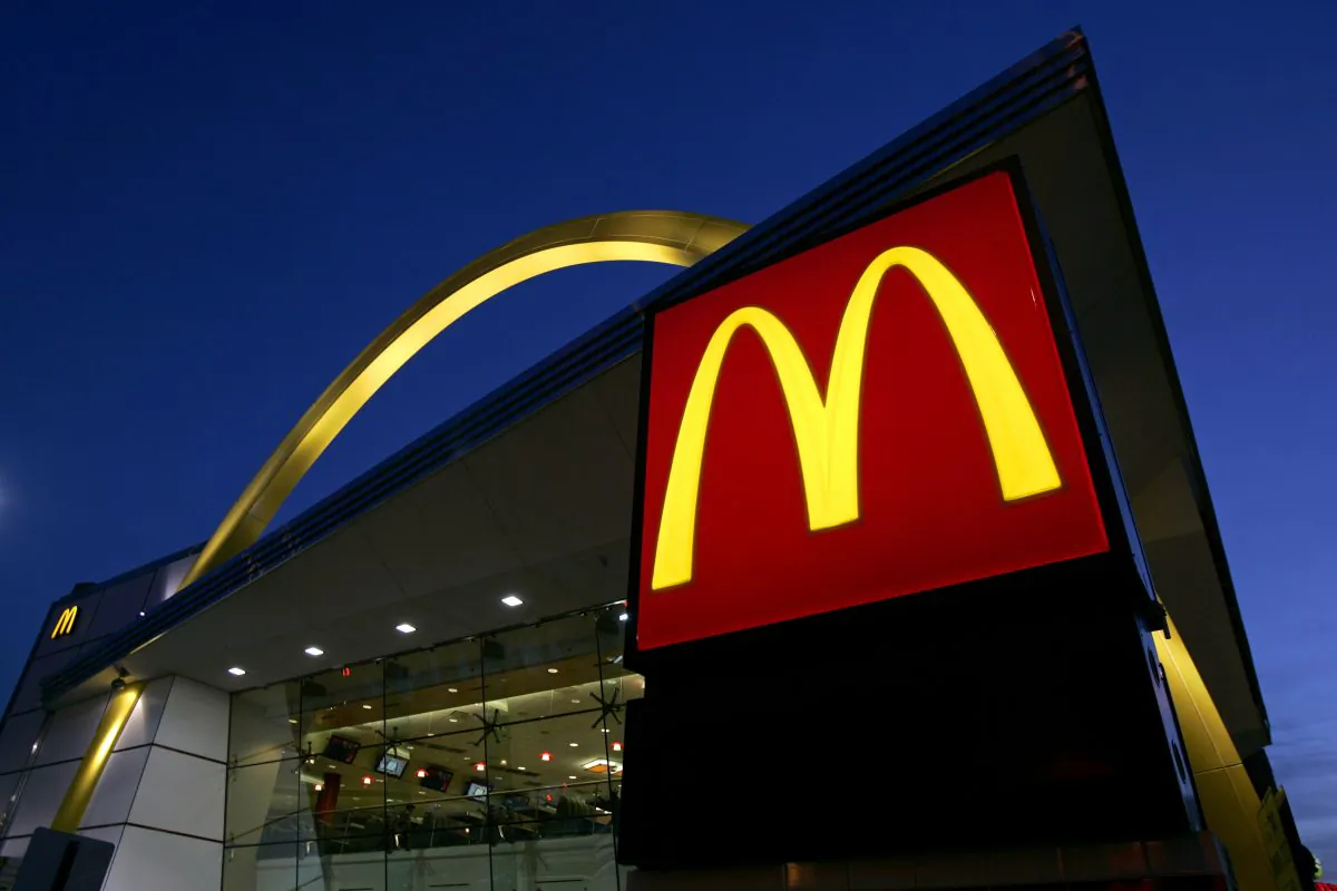FILE-In this April 20, 2006 file photo, a McDonald's restaurant logo and golden arch is lit on Chicago's near North Side. (AP Photo/Jeff Roberson)