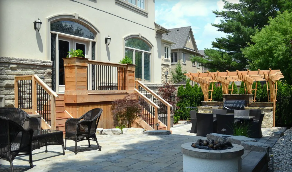 The easiest way to have a low-maintenance backyard is to put a stone patio from fence to fence. (eieihome.com)