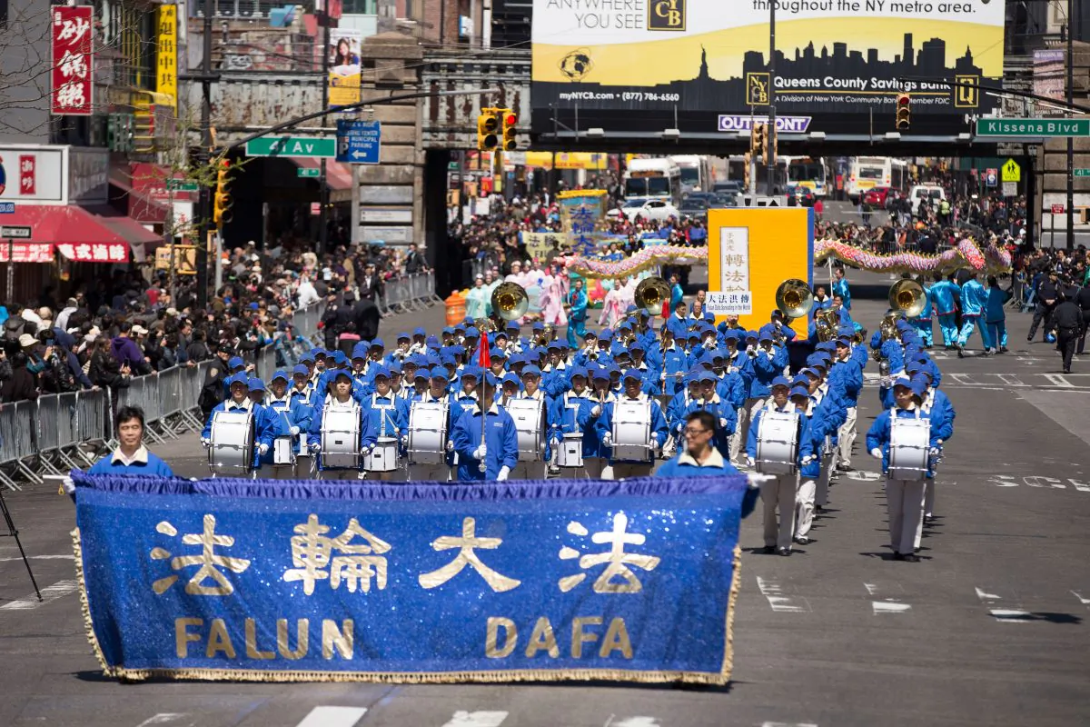 2,000 people march in a parade in Flushing, New York, on April 25, 2015, calling for an end to the persecution of Falun Gong in China and celebrating 200 million people who have quit the Chinese Communist Party since 2004. (Edward Dye/Epoch Times)