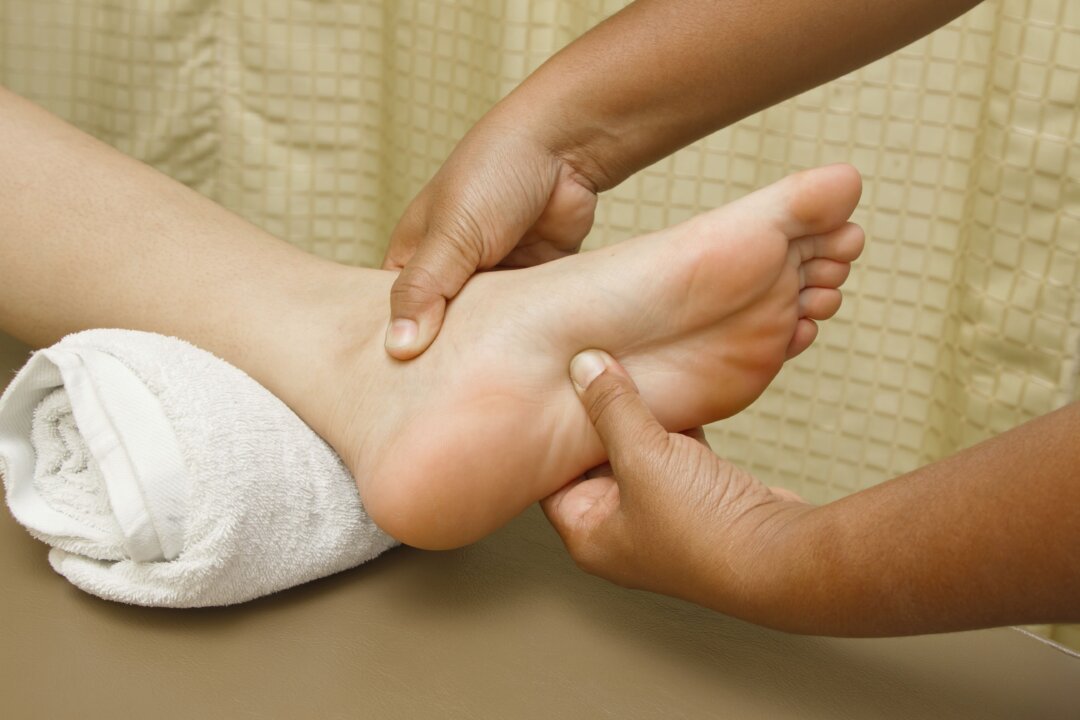 Reflexology involves applying alternating pressure with the hands to specific points on the feet, hands, ears, or face that can affect various organs and parts of the body. (praisaeng/iStock/Thinkstock)