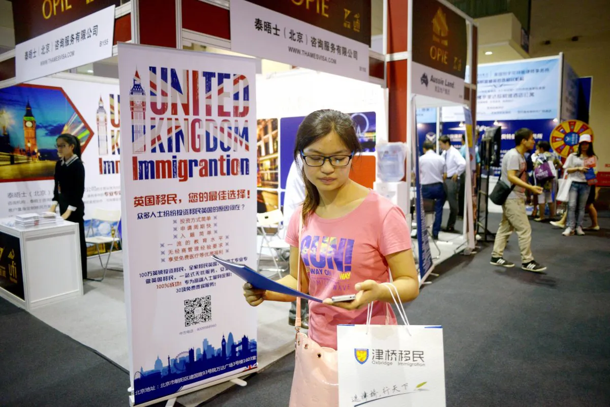A Chinese investor visits an overseas property and immigration exhibition in Beijing on July 4, 2014. (Wang Zhao/AFP/Getty Images)