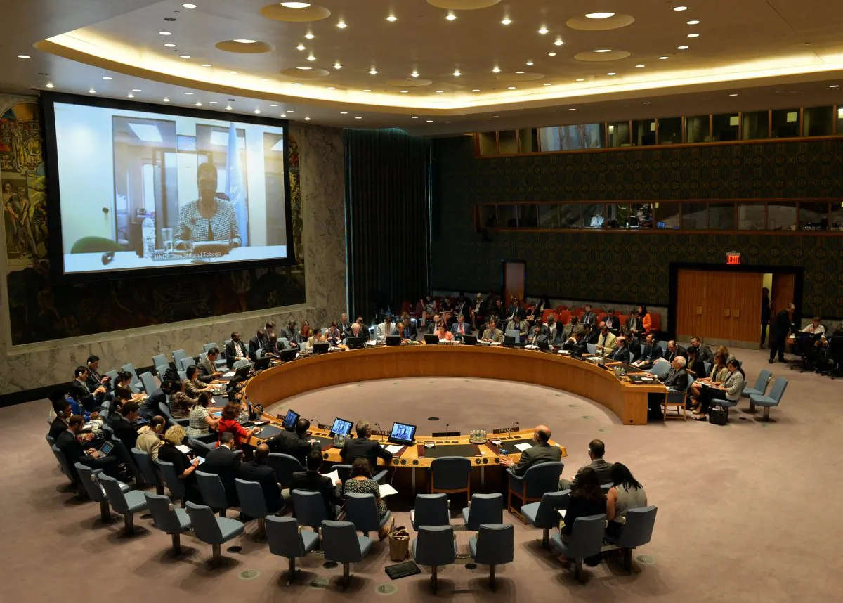 Valerie Amos (on video screen), United Nations undersecretary-general for humanitarian affairs and emergency relief coordinator, addresses the Security Council via video link during a meeting on the situation in the Middle East July 31, 2014, at U.N. headquarters in New York. (STAN HONDA/AFP/Getty Images)