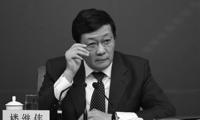 Chinese Finance Minister Lou Jiwei attends a press conference in Beijing on March 5, 2015. Lou warned that China could be headed toward “middle-income trap.” (Wang Zhao/AFP/Getty Images)