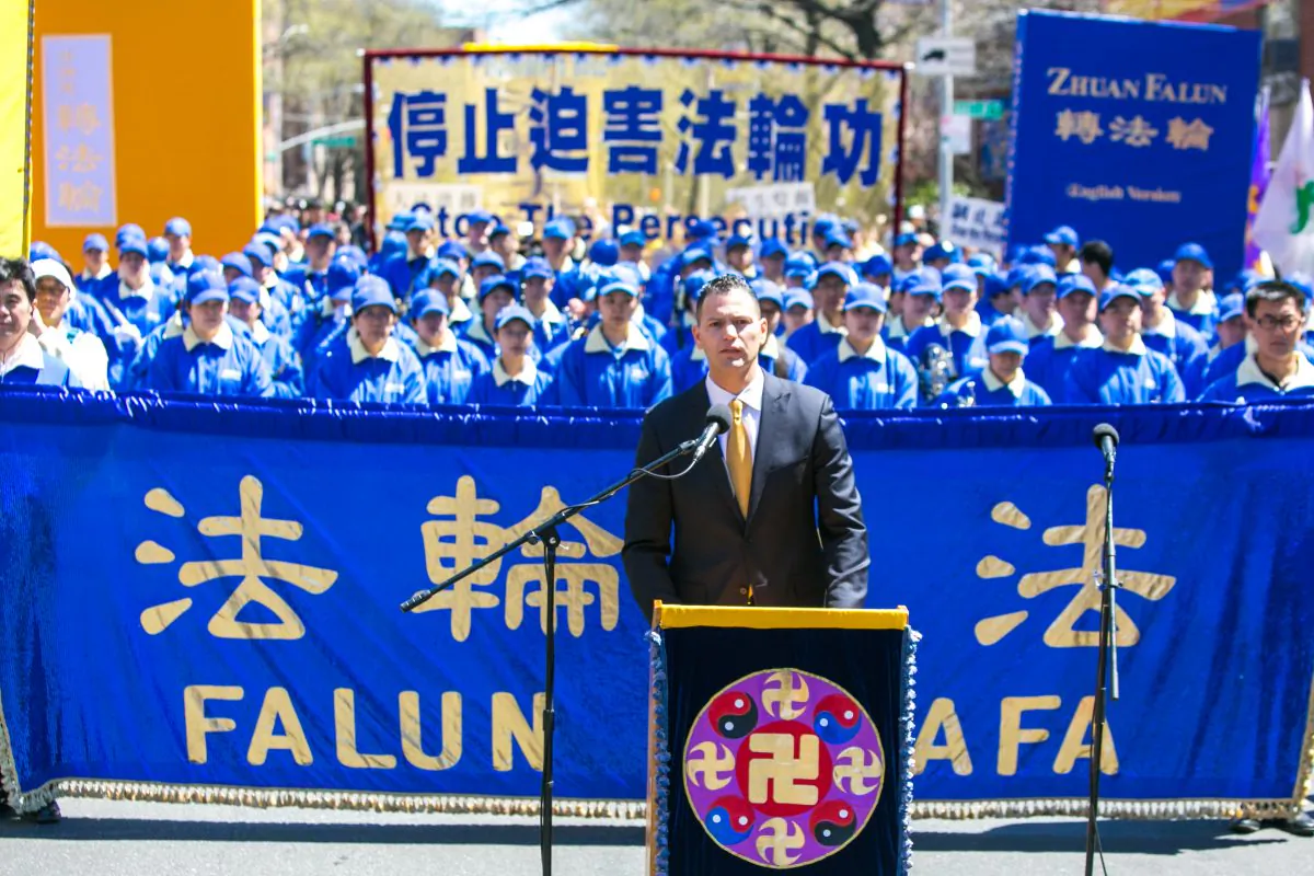 Dr. Damon Noto of Doctors Against Forced Organ Harvesting (DAFOH) speaks at a rally in Flushing on April 25, 2015, calling for an end to the persecution of Falun Gong in China and celebrating 200 million people who have quit the Chinese Communist Party since 2004. (Benjamin Chasteen/Epoch Times)