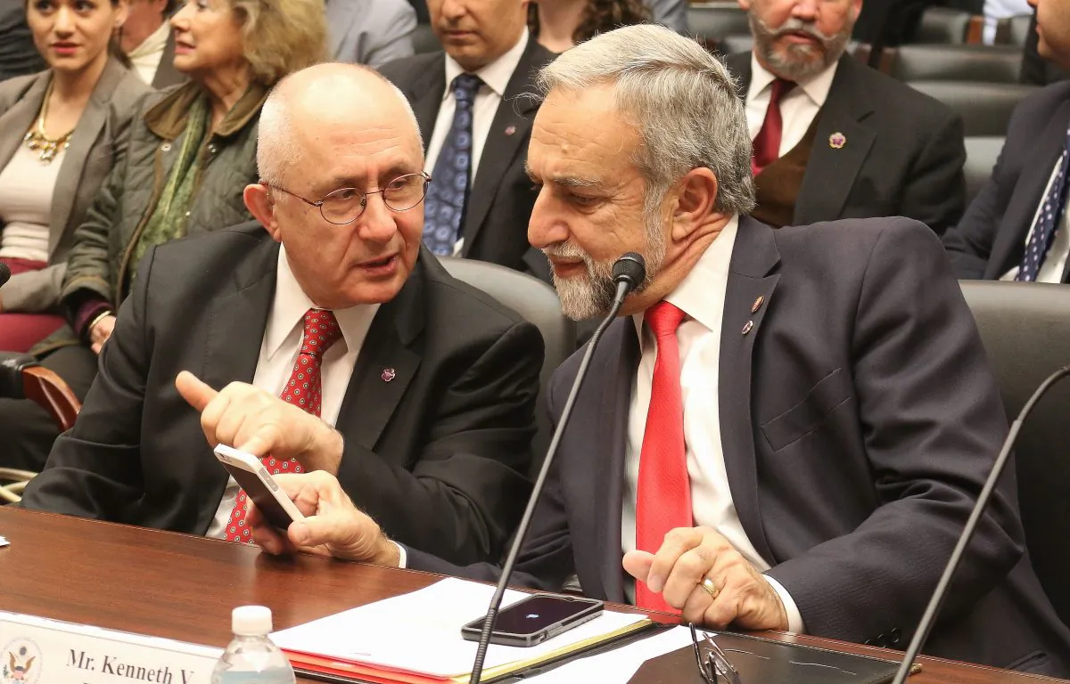 Dr. Taner Akçam (L), professor of history, Clark University converses with Kenneth V. Hachikian, co-chairman, the Armenian National Committee of America, on April 23, at the Helsinki Commission hearing before testifying concerning the Armenian Genocide. (Gary Feuerberg/Epoch Times).