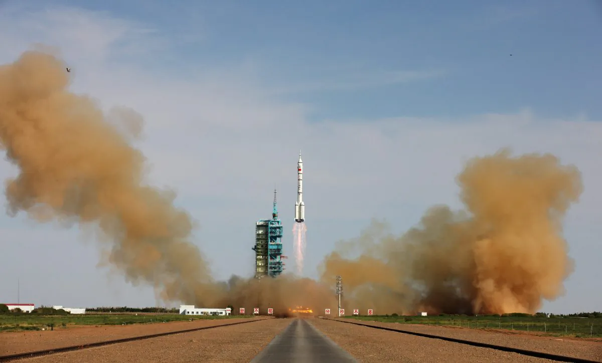 The Long March-2F rocket carrying China's manned Shenzhou-10 spacecraft blasts off from launch pad at Jiuquan Satellite Launch Center in Jiuquan, Gansu Province, China, on June 11, 2013. (ChinaFotoPress/Getty Images)