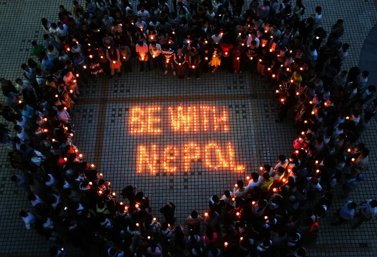Nepalese students and Chinese students gathering to pray for Nepal in Nanhua University in Hengyang, central China's Hunan province on April 26, 2015. (STR/AFP/Getty Images)