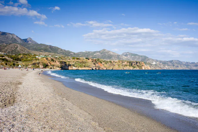 Burriana beach in Nerja, Malaga via Shutterstock*