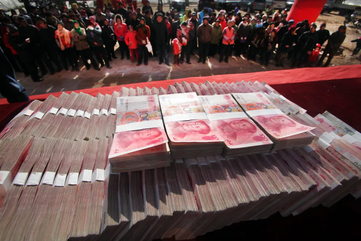A stash of yuans in Jinan, China, on Jan. 20, 2014. The central regime wants to use money to exert control over local governments. (STR/AFP/Getty Images)