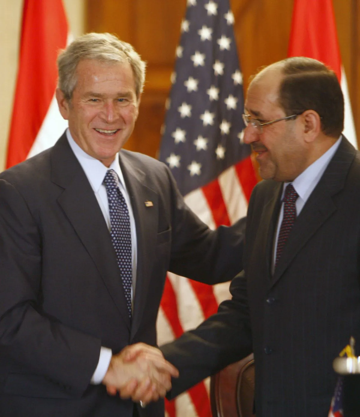 Iraqi Prime Minister Nuri al-Maliki shakes hands with U.S. President George W. Bush (L) during a joint press conference in Baghdad on Dec. 14, 2008. (Thaier Al-Sudani/AFP/Getty Images)