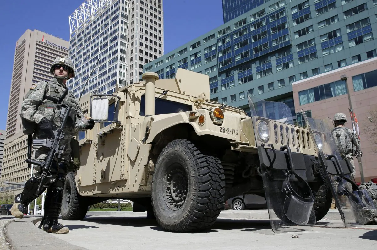 Maryland National Guardsmen patrol near downtown businesses in Baltimore, on Tuesday. (AP Photo/Patrick Semansky)