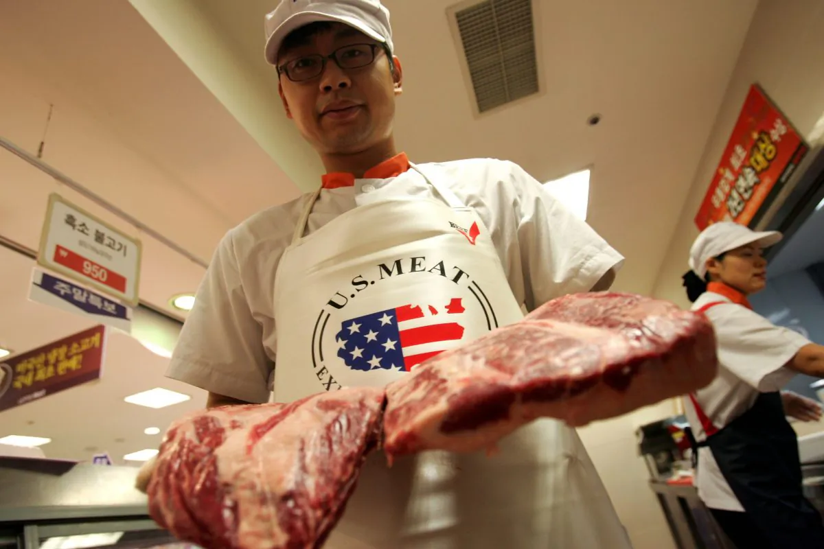An employee prepares imported U.S. beef at a store in Seoul, South Korea, on July 13, 2007. (Chung Sung-Jun/Getty Images)