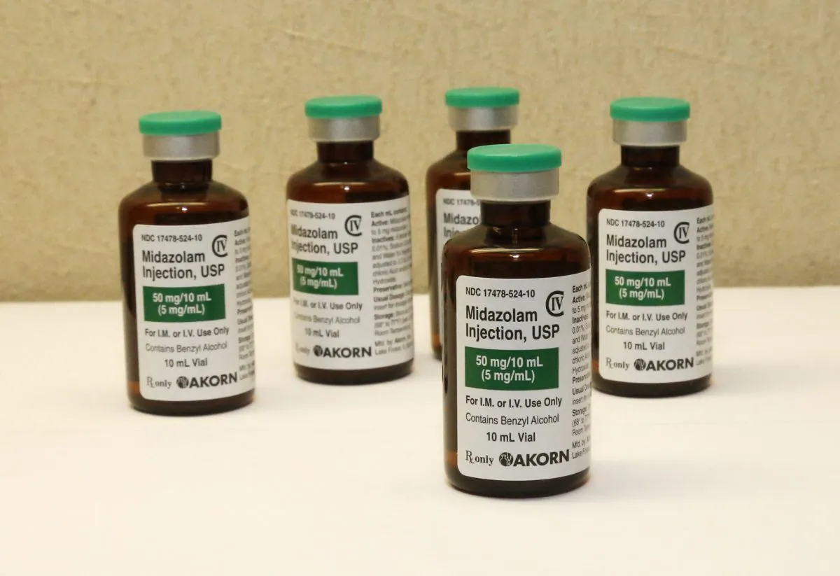 This July 25, 2014 file photo shows bottles of the sedative midazolam at a hospital pharmacy in Oklahoma City. (AP Photo/Sue Ogrocki)