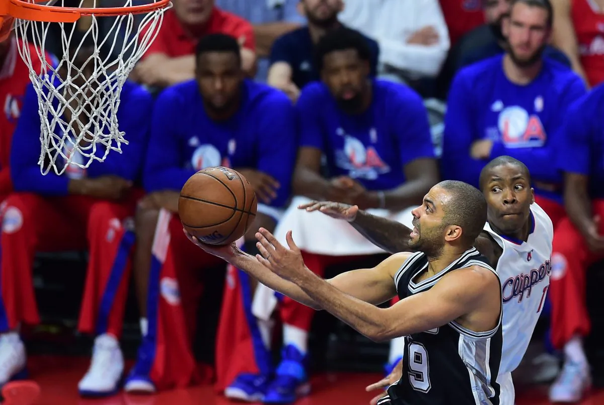Tony Parker of the San Antonio Spurs shoots under pressure from Jamaal Crawford of the Los Angeles Clippers during Game 5 of their first round NBA playoffs series in Los Angeles. (Frederic J. Brown/AFP/Getty Images)
