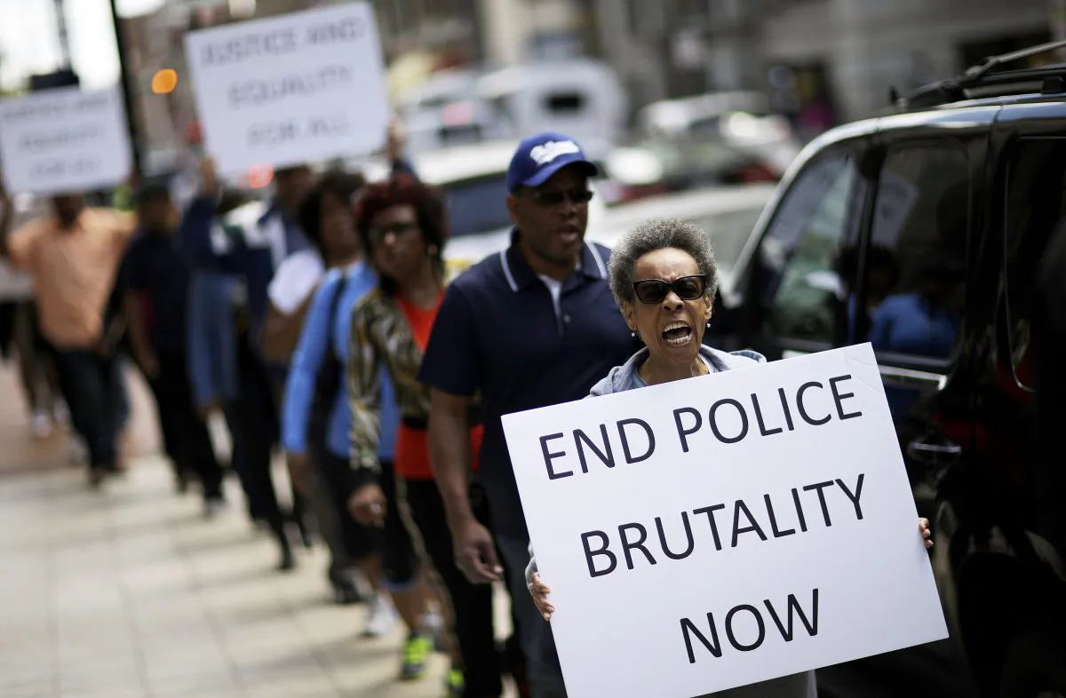 Protestors demonstrate outside the State Attorney's office calling for the continued investigation into the death of Freddie Gray, Wednesday, April 29, 2015, in Baltimore.  (AP Photo/David Goldman)