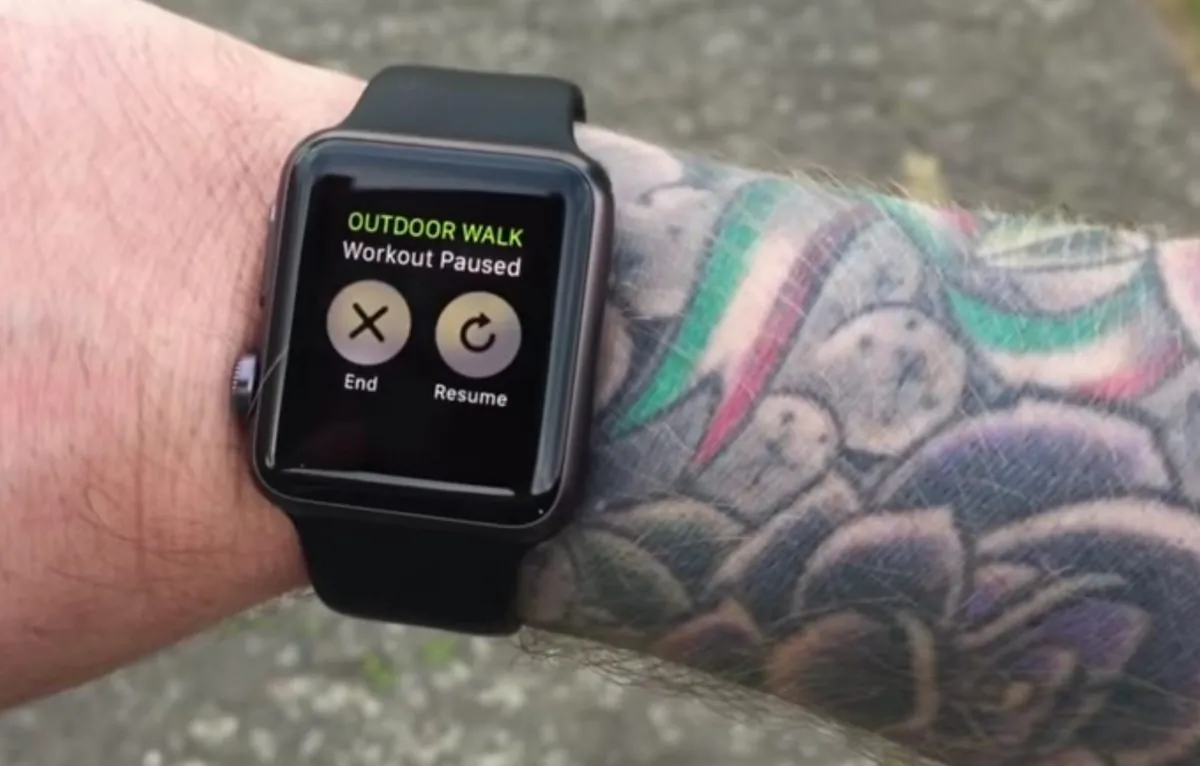 A screenshot of a video posted to YouTube by Michael Lovell showing how he has to frequently re-enter his password when wearing his Apple Watch on his tattooed arm.