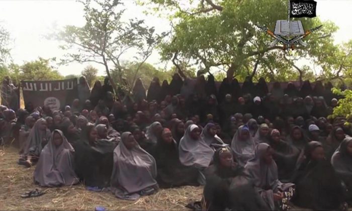 This Monday May 12, 2014 file image taken from video by Nigeria's Boko Haram terrorist network, shows the alleged missing girls abducted from the northeastern town of Chibok. (AP Photo)