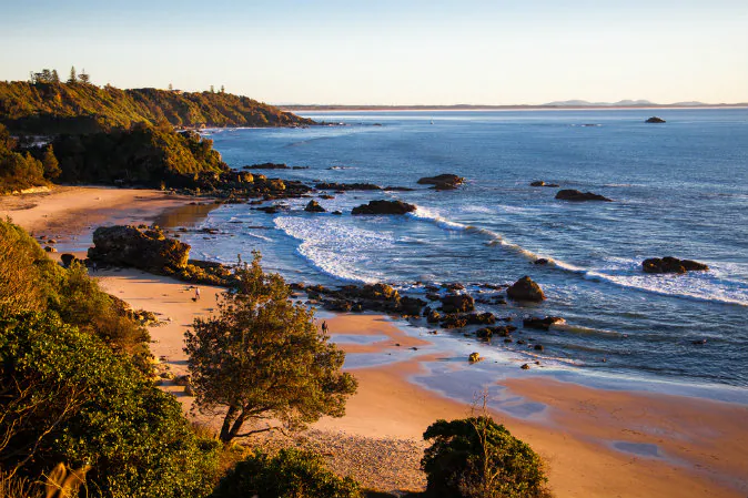 Morning walkers on the beach of Port Macquarie, New South Wales, Australia via Shutterstock*