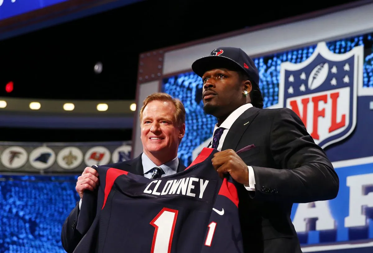 Jadeveon Clowney (R) of the South Carolina Gamecocks stands on stage with NFL Commissioner Roger Goodell after he was picked No. 1 overall by the Houston Texans during the first round of the 2014 NFL Draft at Radio City Music Hall in New York City on May 8, 2014. (Elsa/Getty Images)