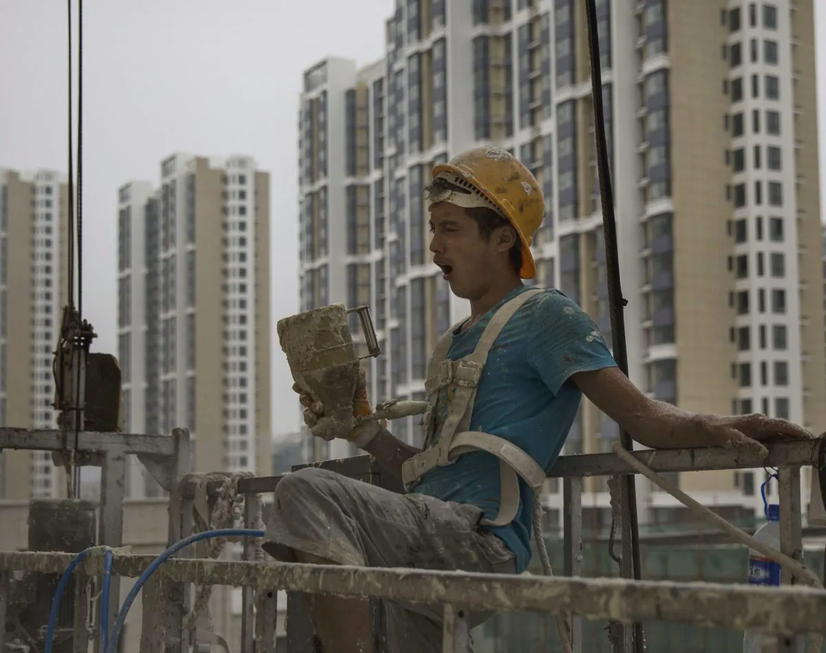 A Chinese construction worker at a new apartment complex on August 29, 2014 in Beijing, China.  (Kevin Frayer/Getty Images)