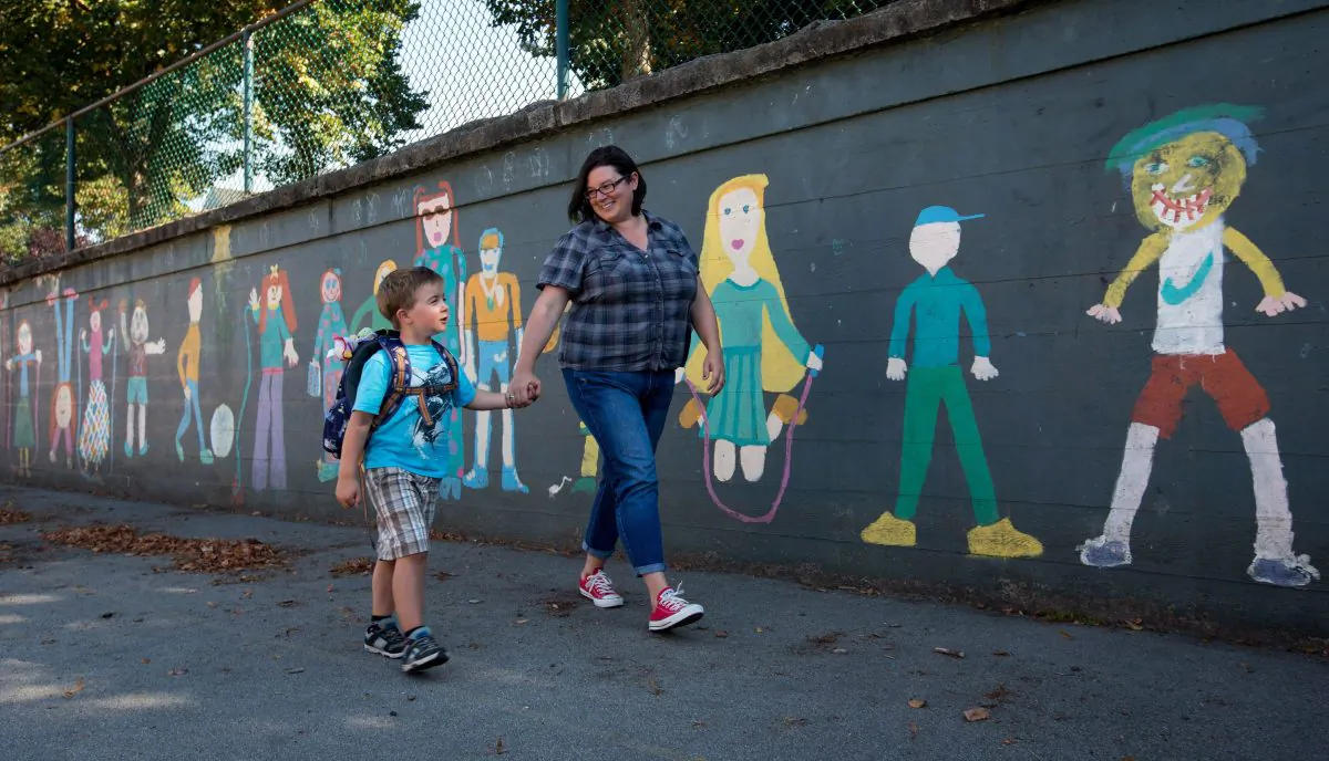 A mother shows her son around the grounds of a school in Vancouver in preparation for his first day in kindergarten, Aug. 20, 2013. A burgeoning teacher-led movement that rejects unproven education education trends is quickly growing, and some educators say a change in how education is delivered in Canada is long overdue. (THE CANADIAN PRESS/Darryl Dyck)