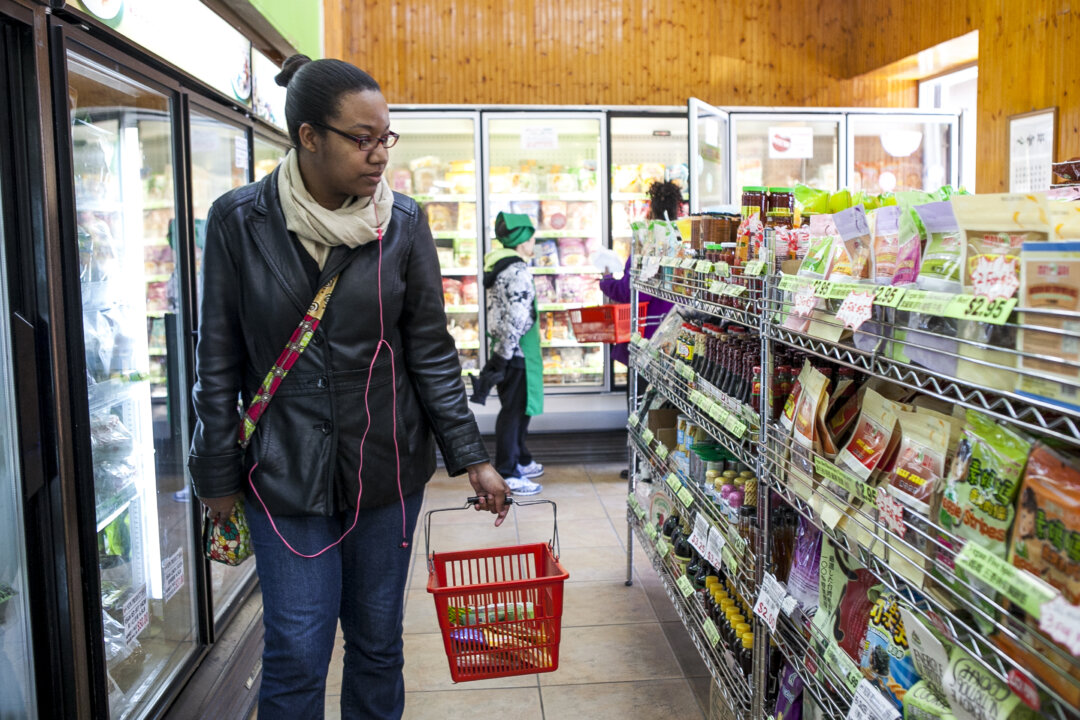A customer shops at May Wah Vegetarian Market April 10, 2014. (Epoch Times)