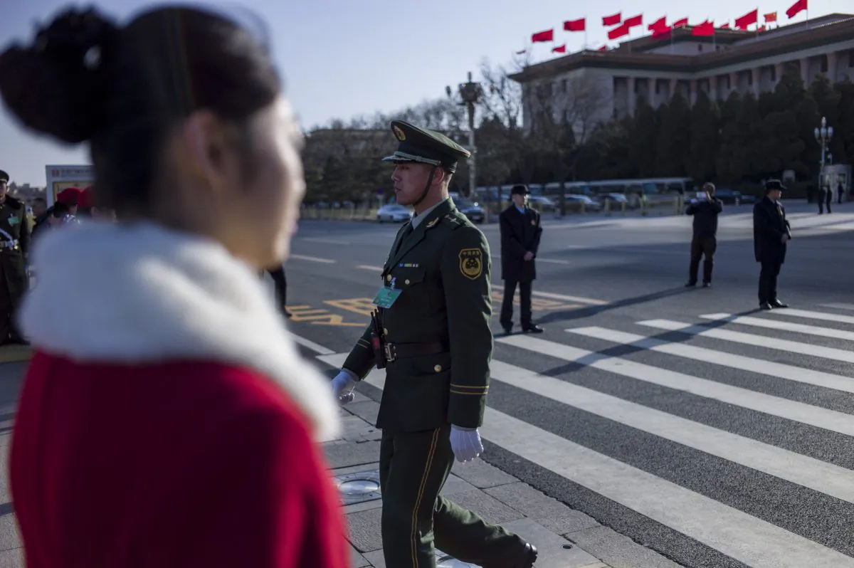 A paramilitary police officer crosses a road during the opening session of the Chinese People's Political Consultative Conference (CPPCC) at the Great Hall of the People in Beijing on March 3, 2015. (Fred Dufour/AFP/Getty Images)