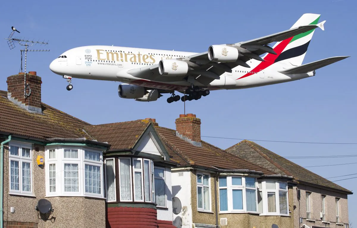 An Emirates Airbus A380 aircraft is seen above roof top as it comes into lane at Heathrow Airport in west London on February 18, 2015. (Justin Tallis/AFP/Getty Images)