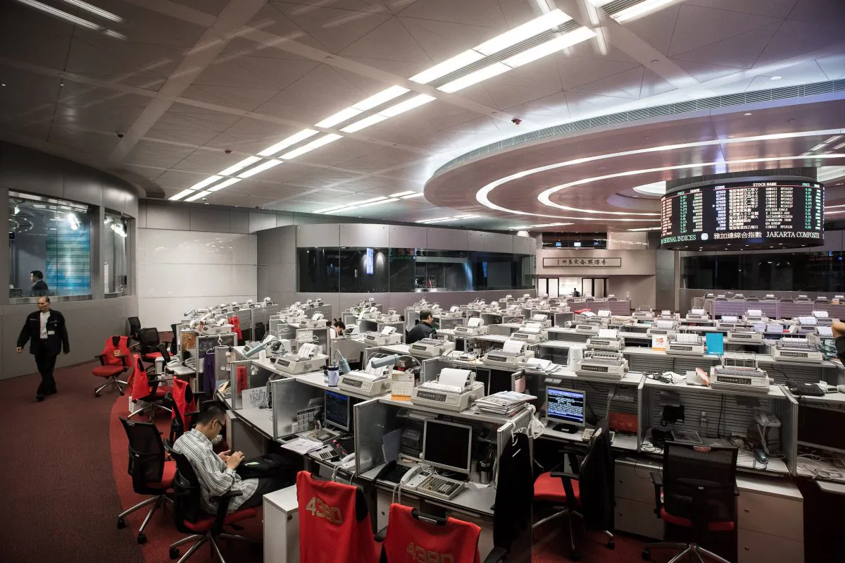 A trader sits at the stock exchange in Hong Kong’s financial district on Nov. 10, 2014. (Philippe Lopez/AFP/Getty Images)