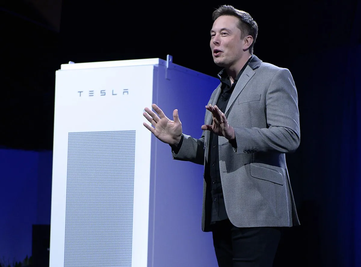 Elon Musk, CEO of Tesla, unveils suite of batteries for homes, businesses, and utilities at Tesla Design Studio on April 30 in Hawthorne, Calif. (Kevork Djansezian/Getty Images) 