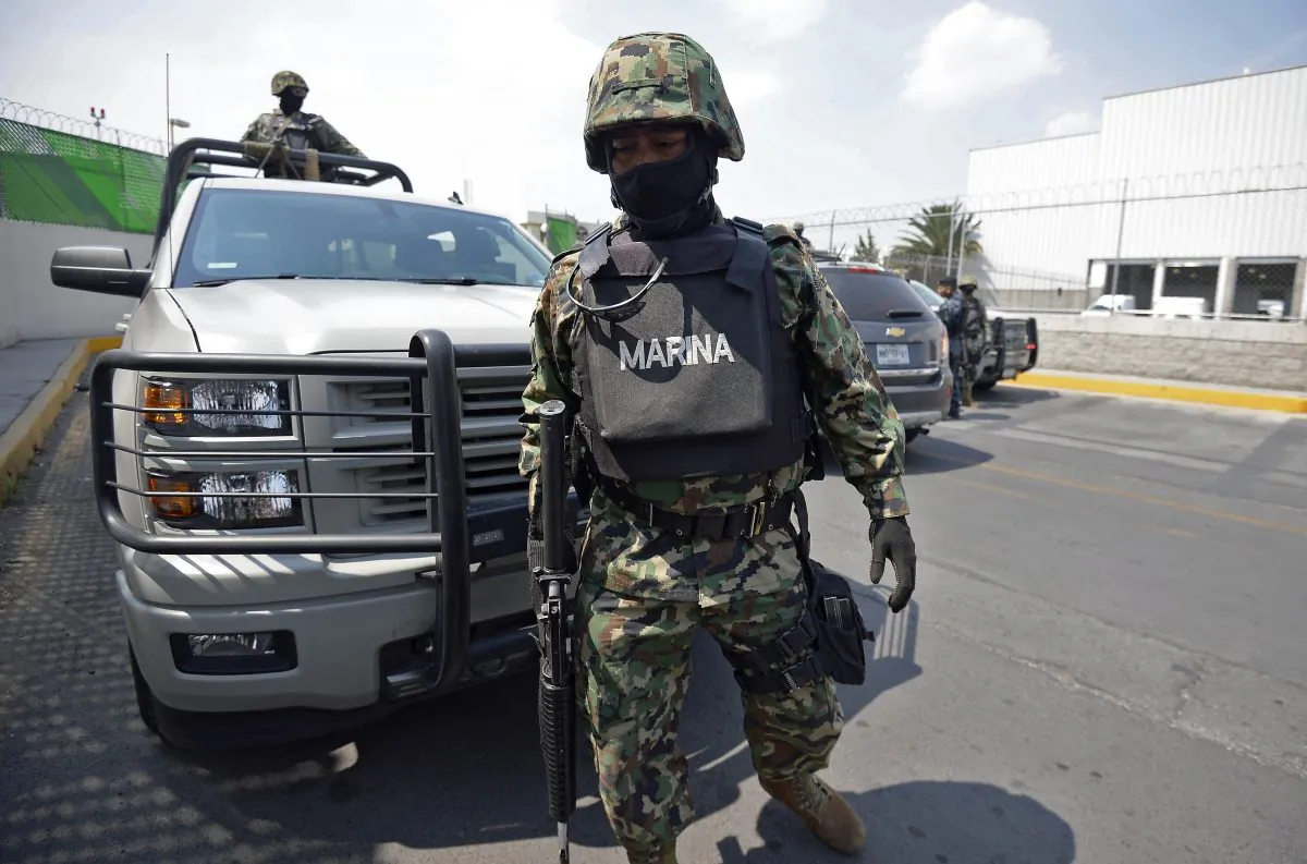 Members of the Mexican Navy stand guard during an operation to present Mexican drug trafficker Joaquin Guzman Loera aka "el Chapo Guzman" to the press, on February 22, 2014 in Mexico City. (Alfredo Estrella/AFP/Getty Images)