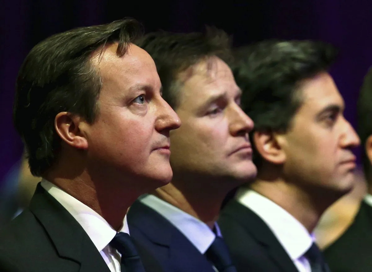 British Prime Minister David Cameron, Deputy Prime Minister Nick Clegg and opposition Labour Party leader Ed Miliband attend a Holocaust Memorial Day ceremony at Central Hall Westminster in London on Jan. 27, 2015. (AP Photo/Chris Jackson)